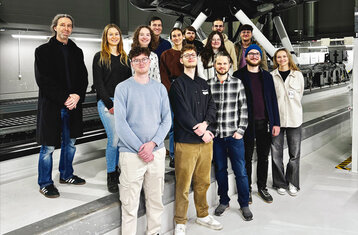 The HFU team and professors in front of the high-fidelity simulator